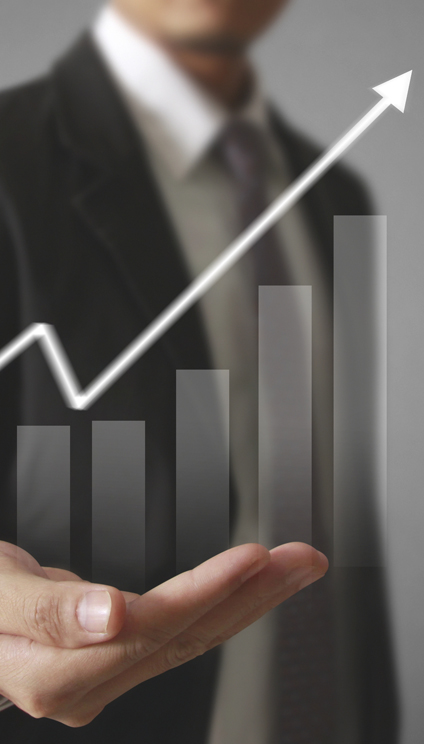 Businessman with financial growth symbols