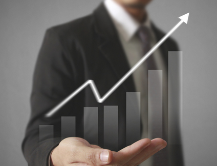Businessman with financial growth symbols