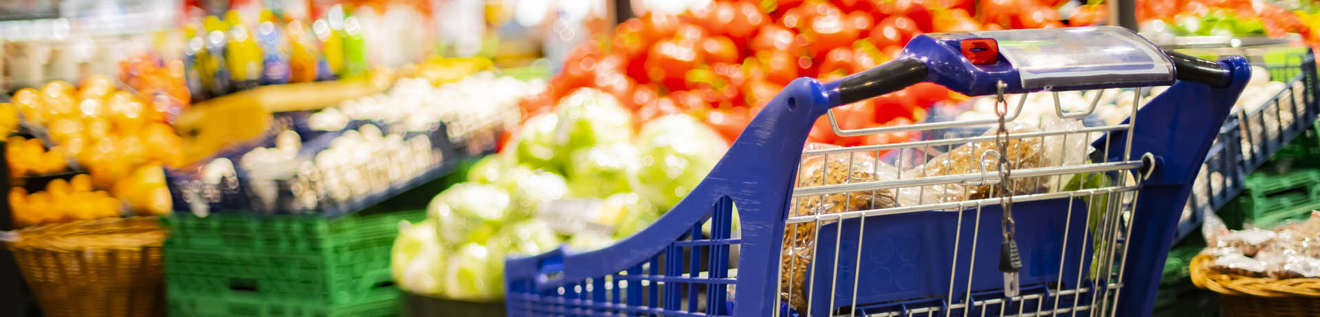 Supermarket cart with fruits, highlighting compliance management system