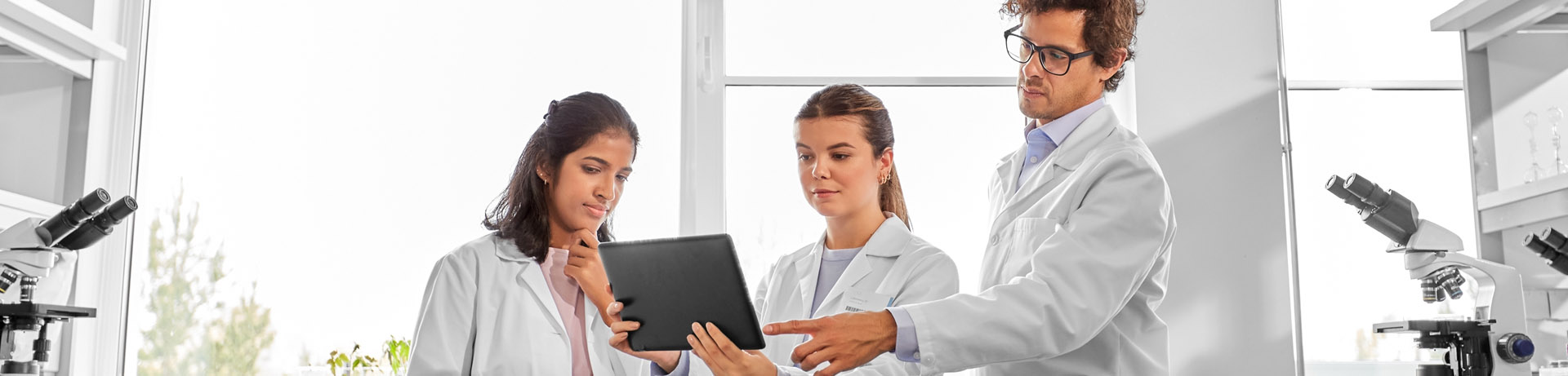 3 experts checking data in laboratory
